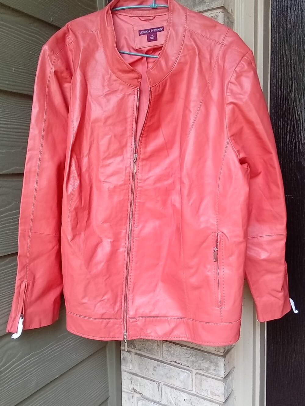 The product is a women's Jessica London burnt orange leather jacket